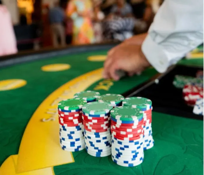 A luxurious gaming hall featuring a stylish guest near a roulette station — the visual signature of TKHOT.